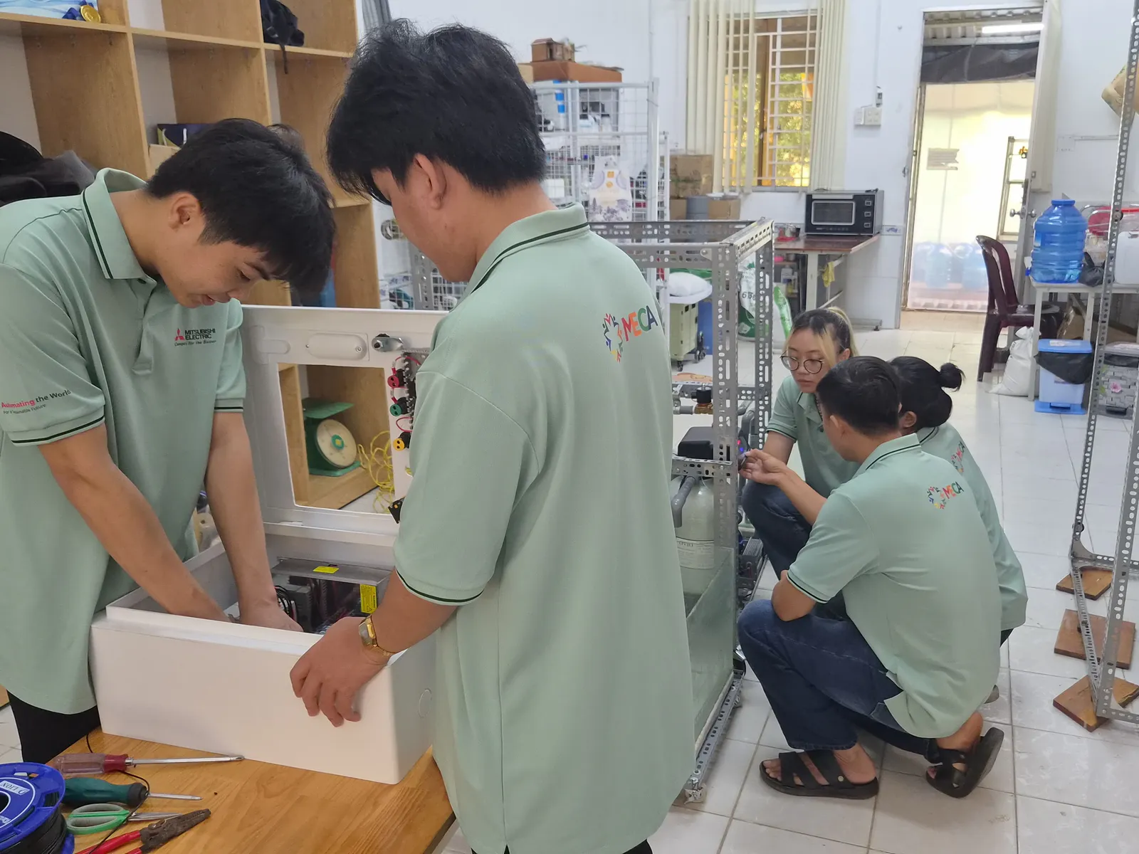 Image of a research team testing a water treatment system